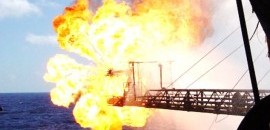 flaring boom, burner showing oil flare during well test operations